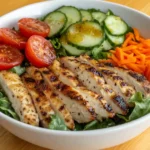 Unique healthy salad bowl with mixed vegetables, lean protein, and vinaigrette.