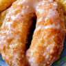 Homemade Buttermilk Bar Doughnuts stacked on wooden board