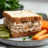 Tuna egg sandwich served on whole wheat bread