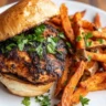 Blackened chicken sandwich served with fries
