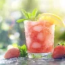 Frozen strawberry lemonade in a glass with garnish